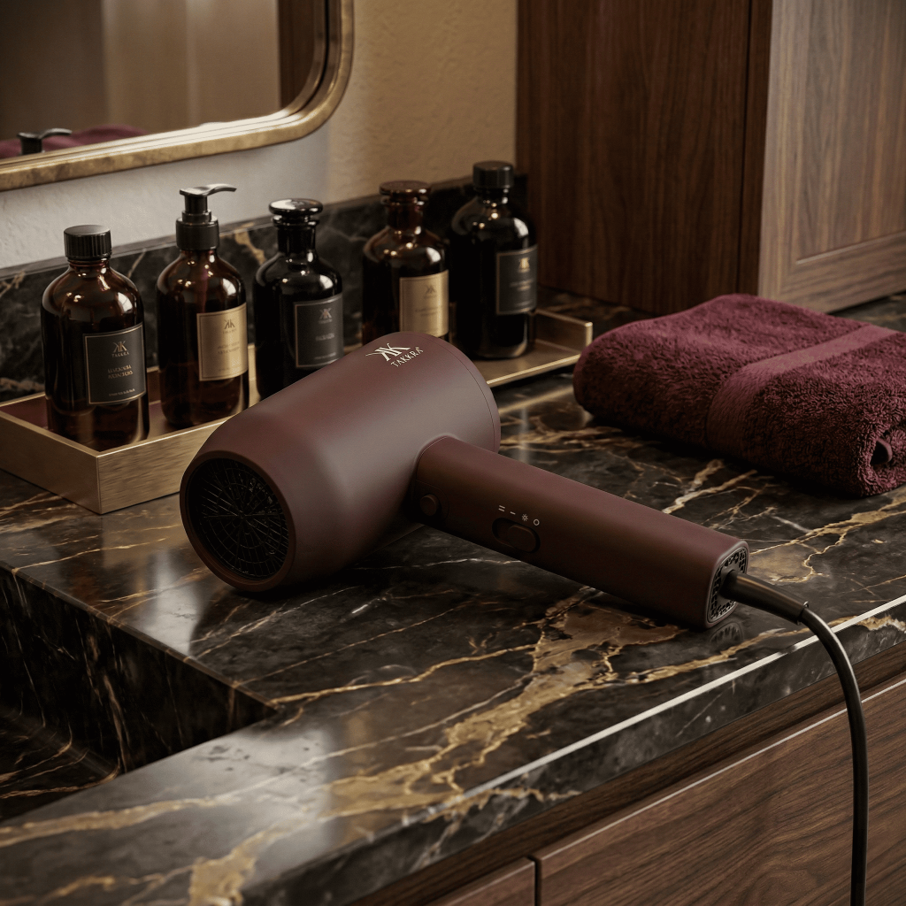 Takkra Aerowave Dryer on counter with hair care products in background