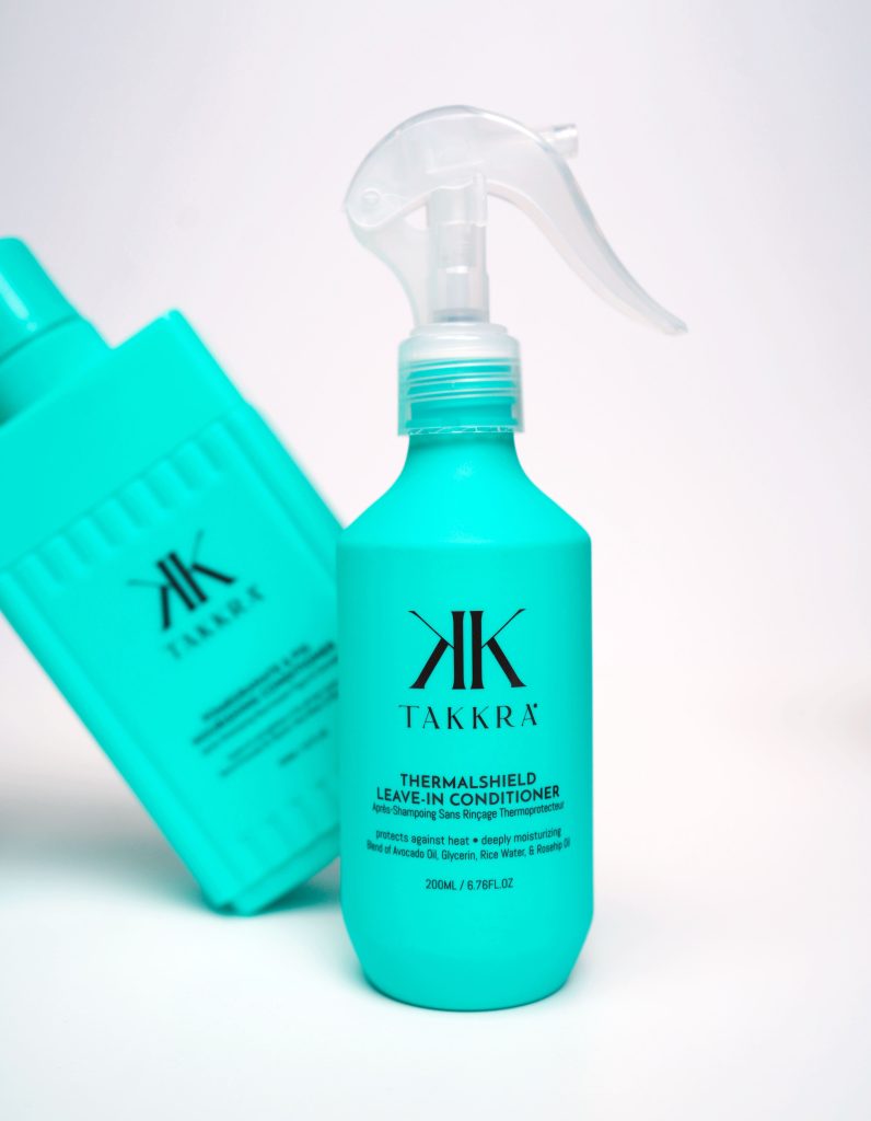 Takkra Thermal Shield Leave-in Conditioner with another Takkra product in the background